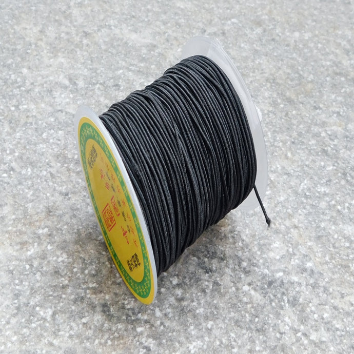 Elastisk tygklädd tråd svart 0,8 mm