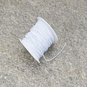 Elastisk tygklädd tråd vit 0,8 mm